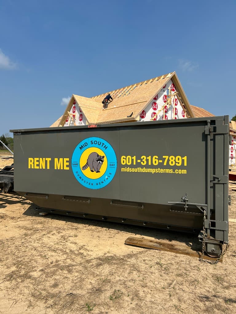 Mid South Dumpster Rentals dumpster on new construction site in Mississippi